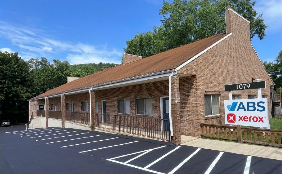 ABS Xerox office and showroom, 1079 Whalley Ave, New Haven CT Advantage Business Systems Xerox office at 1079 Whalley Ave, New Haven, CT — brick building with ABS and Xerox signage and free on-site parking.